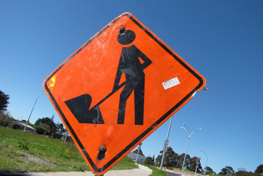 An orange roadworks sign in New Zealand