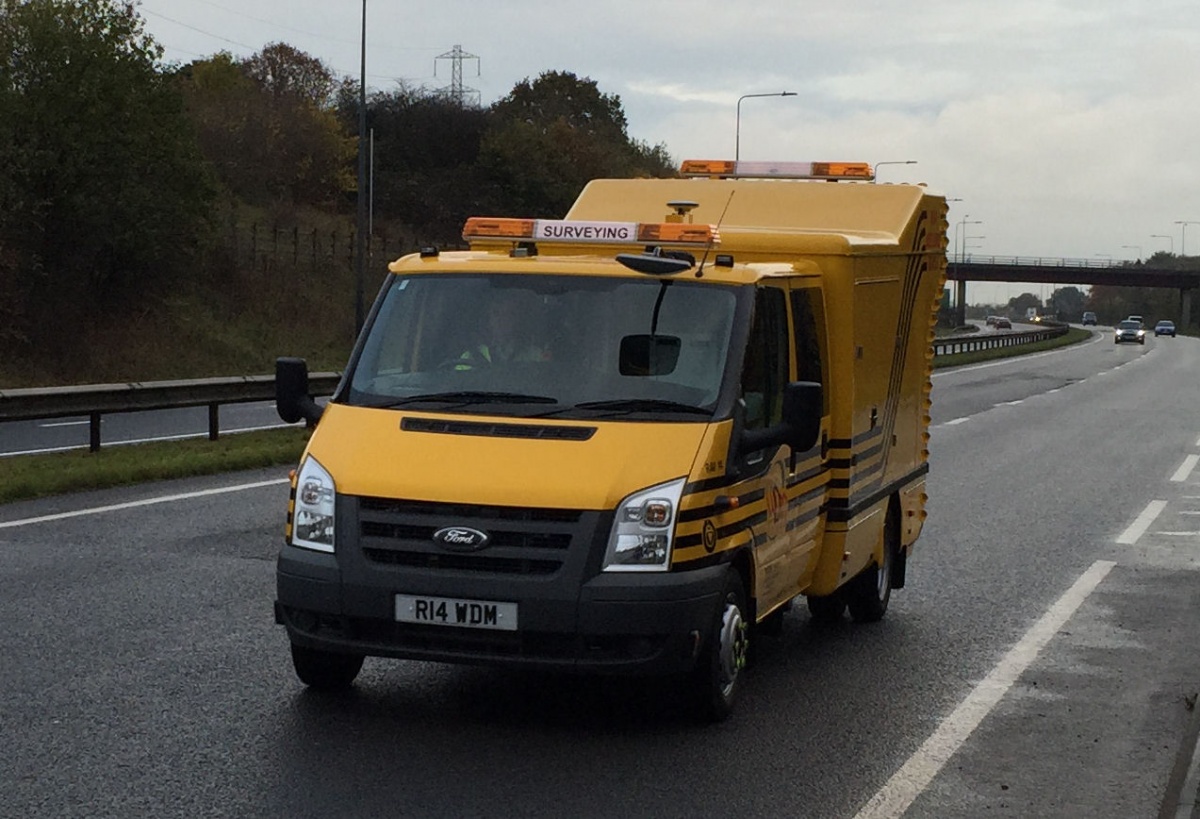 Yellow RAV Scanner survey on a wet road